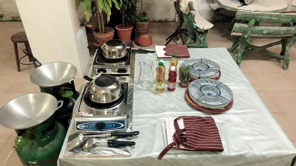 Two burners with pots on them, ready for a class.