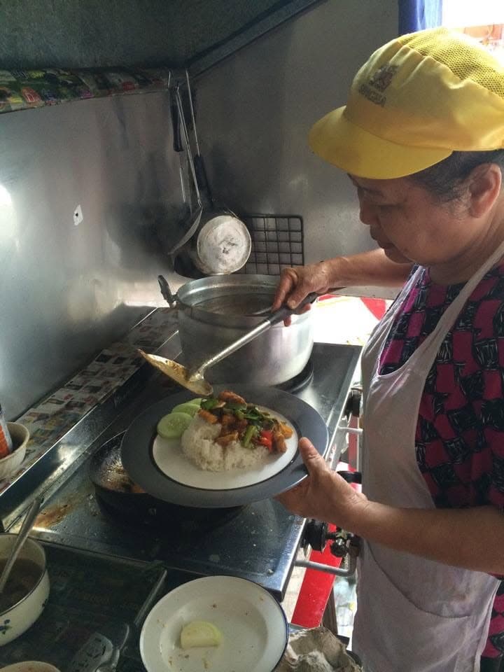 Serving rice and a stir-fry at the home stove.